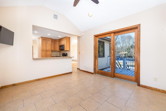 unfurnished living room featuring light tile patterned floors, ceiling fan, and lofted ceiling