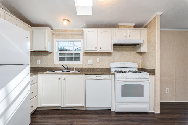 kitchen with dark hardwood / wood-style flooring, ornamental molding, white appliances, sink, and white cabinets