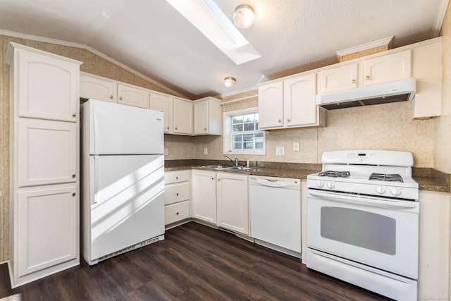 kitchen with white appliances, lofted ceiling, white cabinets, sink, and dark hardwood / wood-style floors