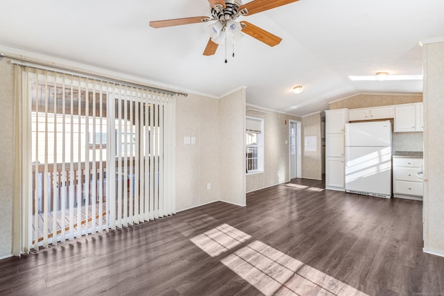 interior space featuring ceiling fan, crown molding, lofted ceiling, and dark wood-type flooring