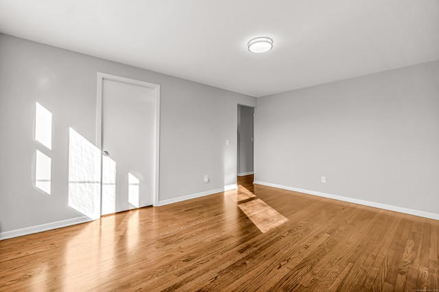 unfurnished room featuring light wood-type flooring