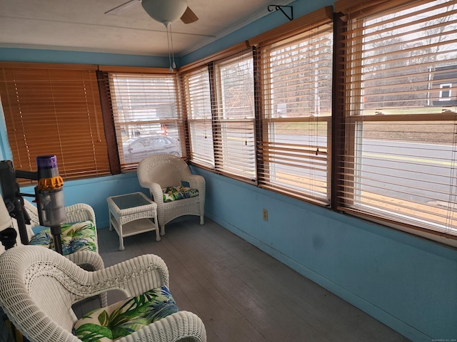 sunroom / solarium with ceiling fan