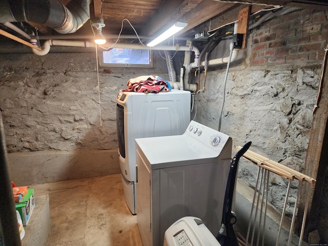 laundry area featuring washing machine and clothes dryer