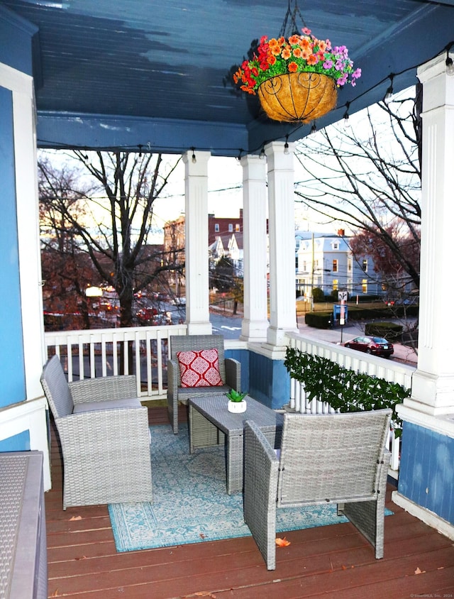 wooden terrace featuring covered porch