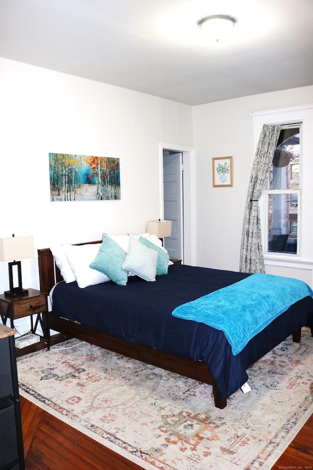 bedroom featuring dark hardwood / wood-style floors