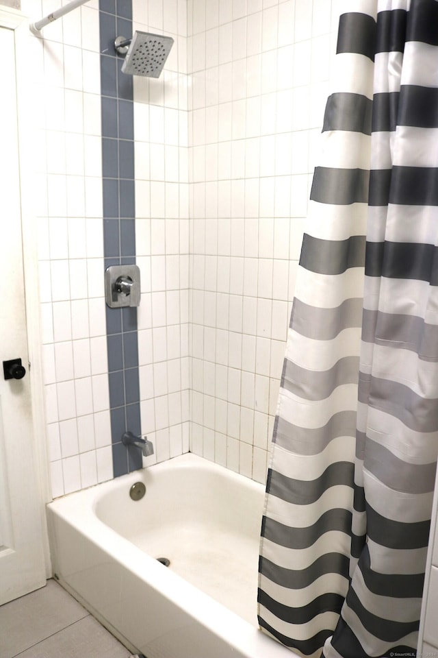 bathroom featuring tile patterned floors and shower / bathtub combination with curtain