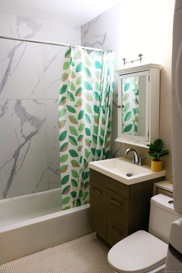 bathroom featuring tile patterned flooring, shower / tub combo, and vanity