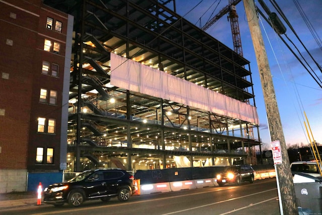 view of outdoor building at dusk