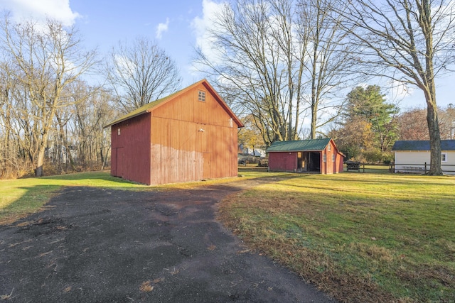 view of outbuilding with a lawn