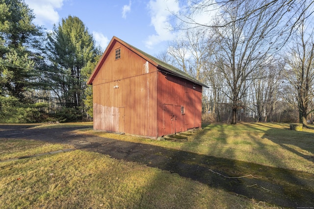 view of outdoor structure with a lawn