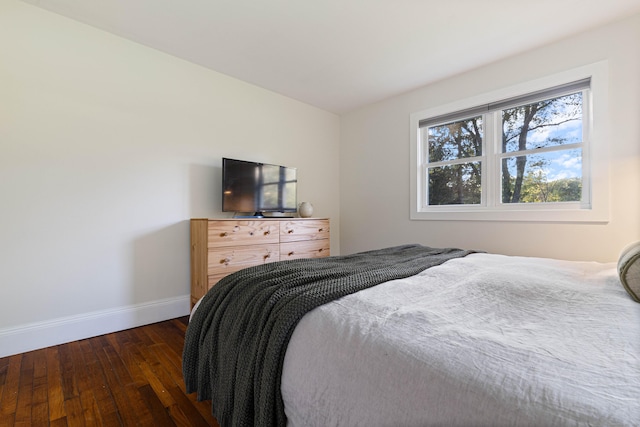 bedroom featuring dark hardwood / wood-style flooring