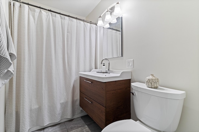 bathroom with tile patterned floors, vanity, and toilet