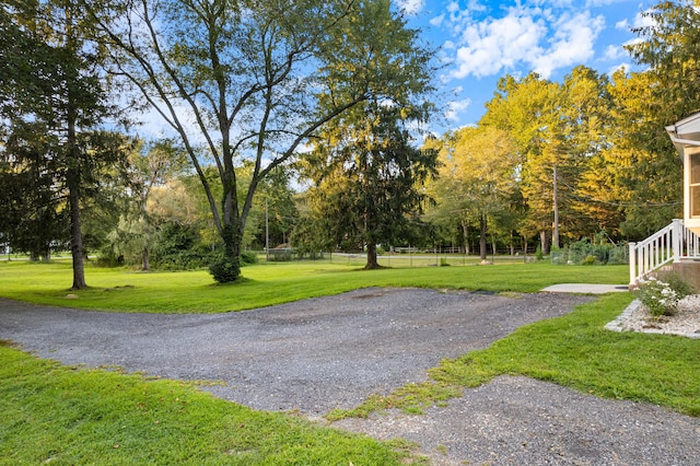 view of home's community featuring a lawn