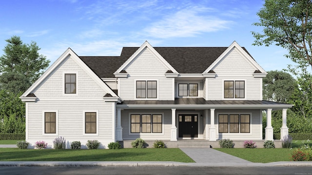 view of front of house with covered porch and a front yard