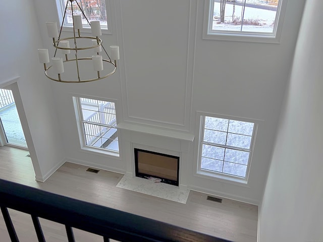 unfurnished living room with a chandelier