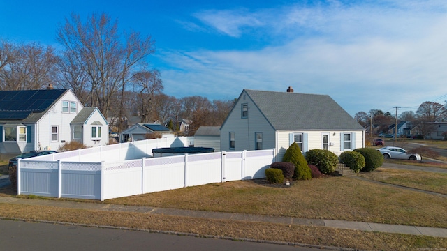 view of side of property featuring a yard