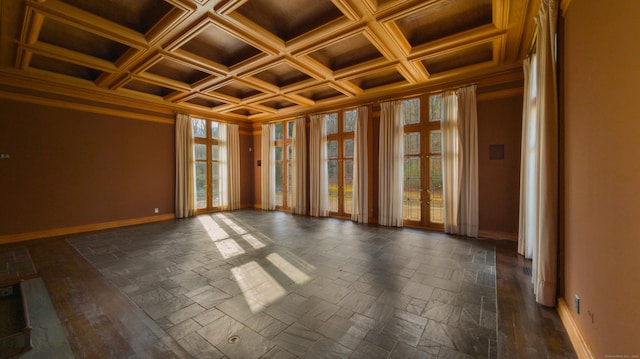 empty room with wood ceiling, ornamental molding, beamed ceiling, and coffered ceiling