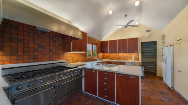 kitchen with exhaust hood, backsplash, stainless steel gas cooktop, lofted ceiling, and white fridge with ice dispenser