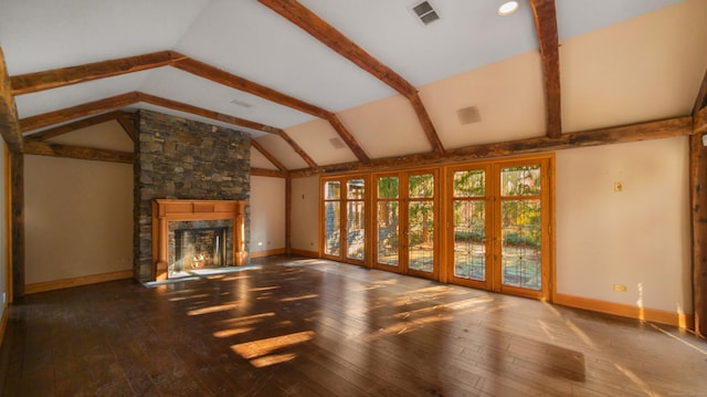 unfurnished living room with lofted ceiling with beams, a stone fireplace, and hardwood / wood-style flooring