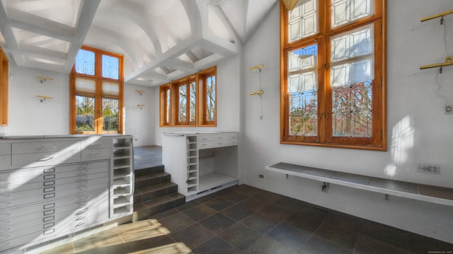 entrance foyer featuring high vaulted ceiling and french doors