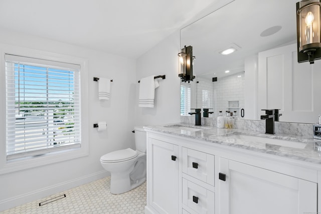 bathroom with vanity, toilet, and a shower with shower door