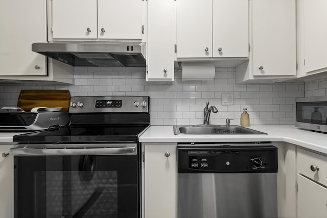 kitchen featuring white cabinetry, stainless steel appliances, and range hood