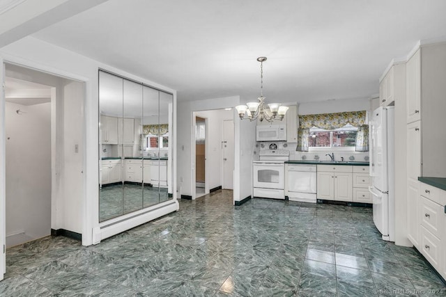 kitchen with white cabinetry, sink, a chandelier, white appliances, and decorative backsplash