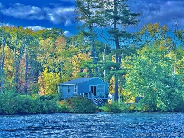 94 Little Meadow Rd, Haddam, CT 06438 - view of front facade featuring a wooded view, a water view, and stairway