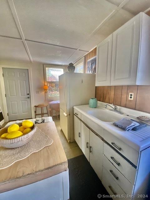 94 Little Meadow Rd, Haddam, CT 06438 - kitchen featuring white cabinetry and light countertops