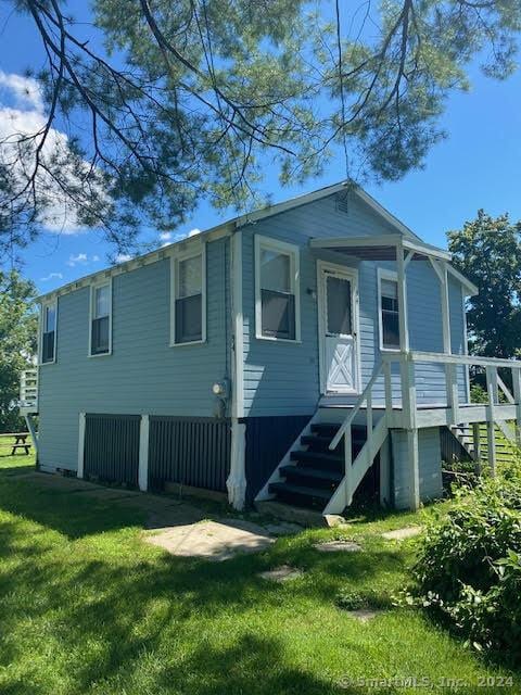 94 Little Meadow Rd, Haddam, CT 06438 - rear view of property featuring a lawn and stairway