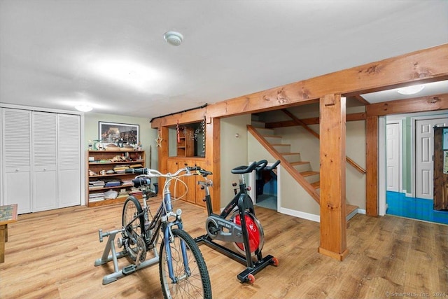 workout room featuring hardwood / wood-style flooring