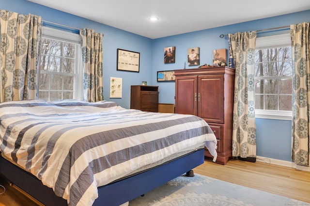 bedroom with light hardwood / wood-style flooring