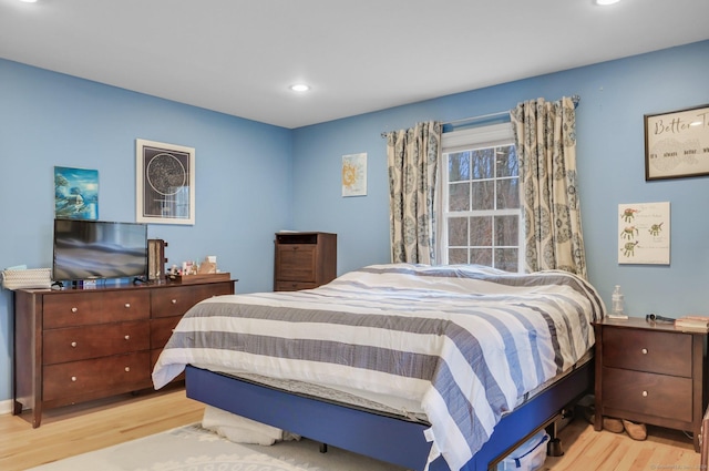 bedroom with light hardwood / wood-style flooring