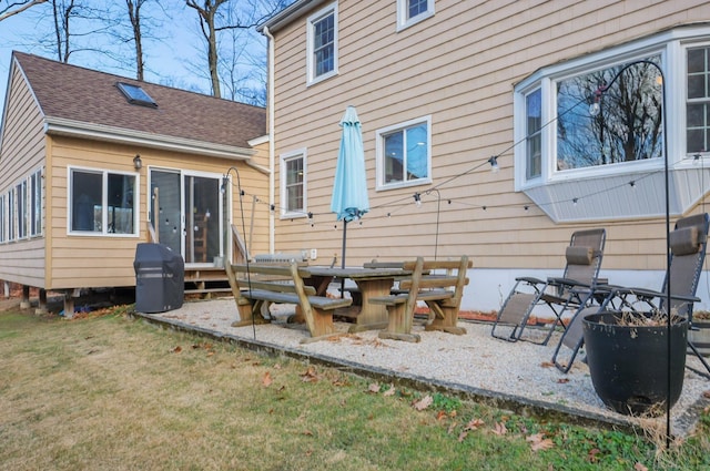 rear view of house with a yard