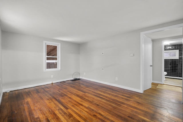 unfurnished room featuring dark hardwood / wood-style floors