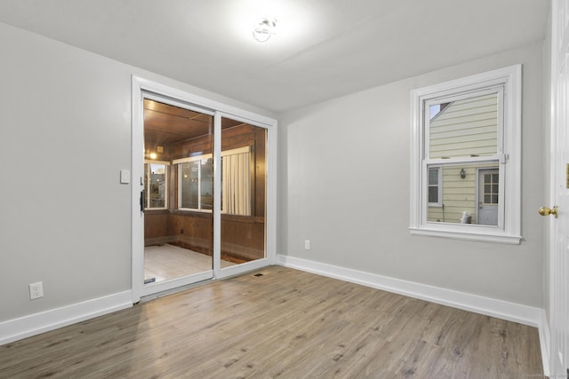 spare room with wood-type flooring