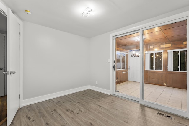 spare room featuring light wood-type flooring