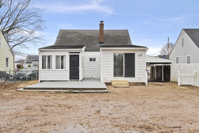 rear view of house with a deck