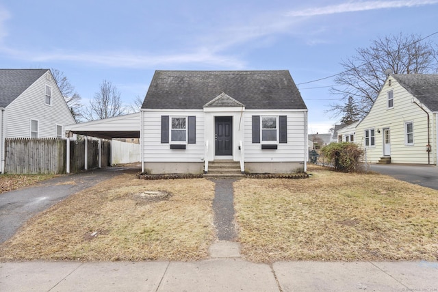 view of front of property featuring a carport