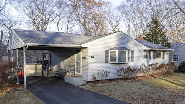 ranch-style house with a carport