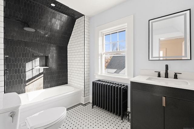 full bathroom with vanity, lofted ceiling, tiled shower / bath combo, toilet, and radiator heating unit