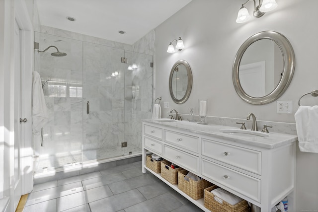 bathroom featuring a shower with door, tile patterned floors, and vanity