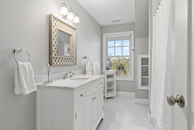 bathroom with vanity and tile patterned flooring