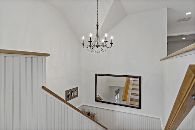 interior space with vaulted ceiling and a notable chandelier