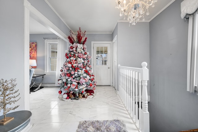 foyer entrance with ornamental molding and a notable chandelier