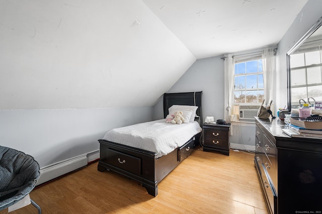 bedroom with a baseboard radiator, light hardwood / wood-style flooring, cooling unit, and lofted ceiling