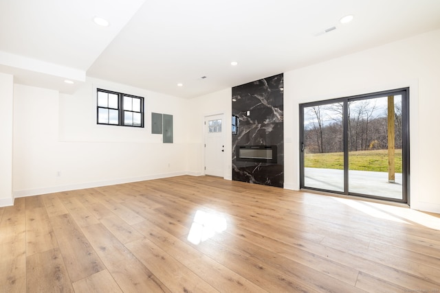 unfurnished living room featuring light wood-type flooring