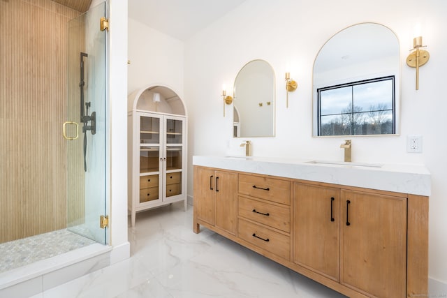 bathroom featuring vanity and a shower with door