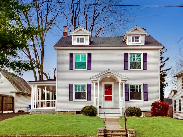 colonial inspired home with a front yard