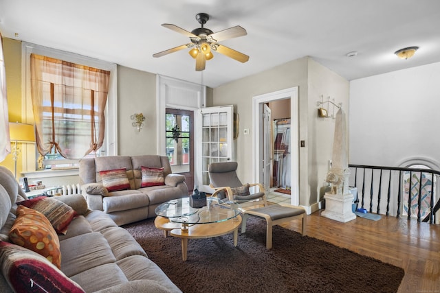 living room with hardwood / wood-style floors and ceiling fan